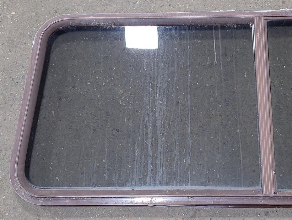 Used Slanted Brown Radius Opening Window : 22 1/8" H X 58 3/4" W  X 2" D