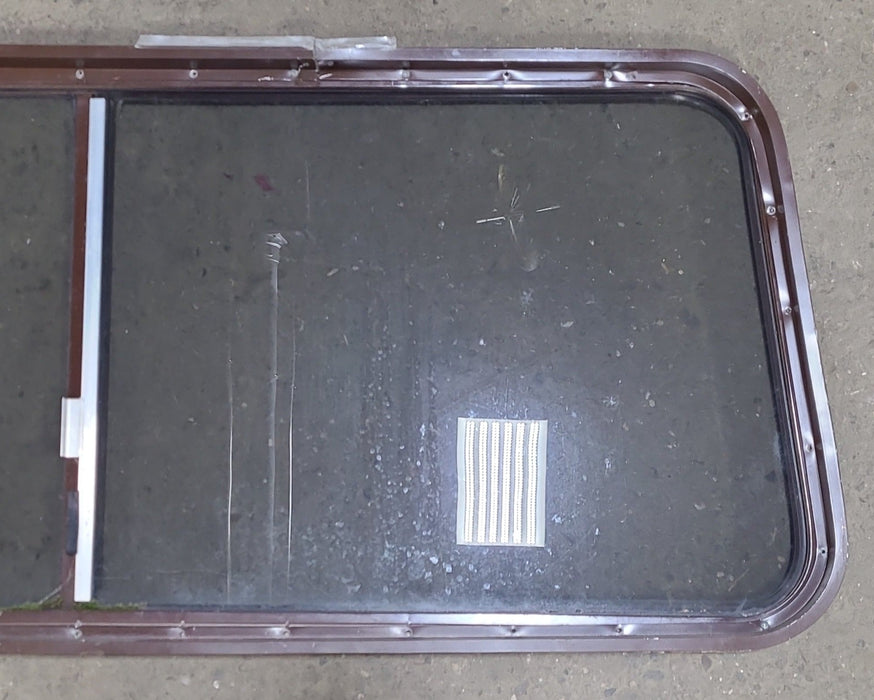 Used Slanted Brown Radius Opening Window : 22 1/8" H X 58 3/4" W  X 2" D