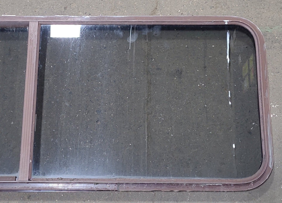 Used Slanted Brown Radius Opening Window : 22 1/8" H X 58 3/4" W  X 2" D