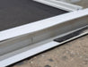 Used Slanted White Radius Opening Window : 46 3/4" W x 21 1/4" H x 1 1/4" D - Young Farts RV Parts